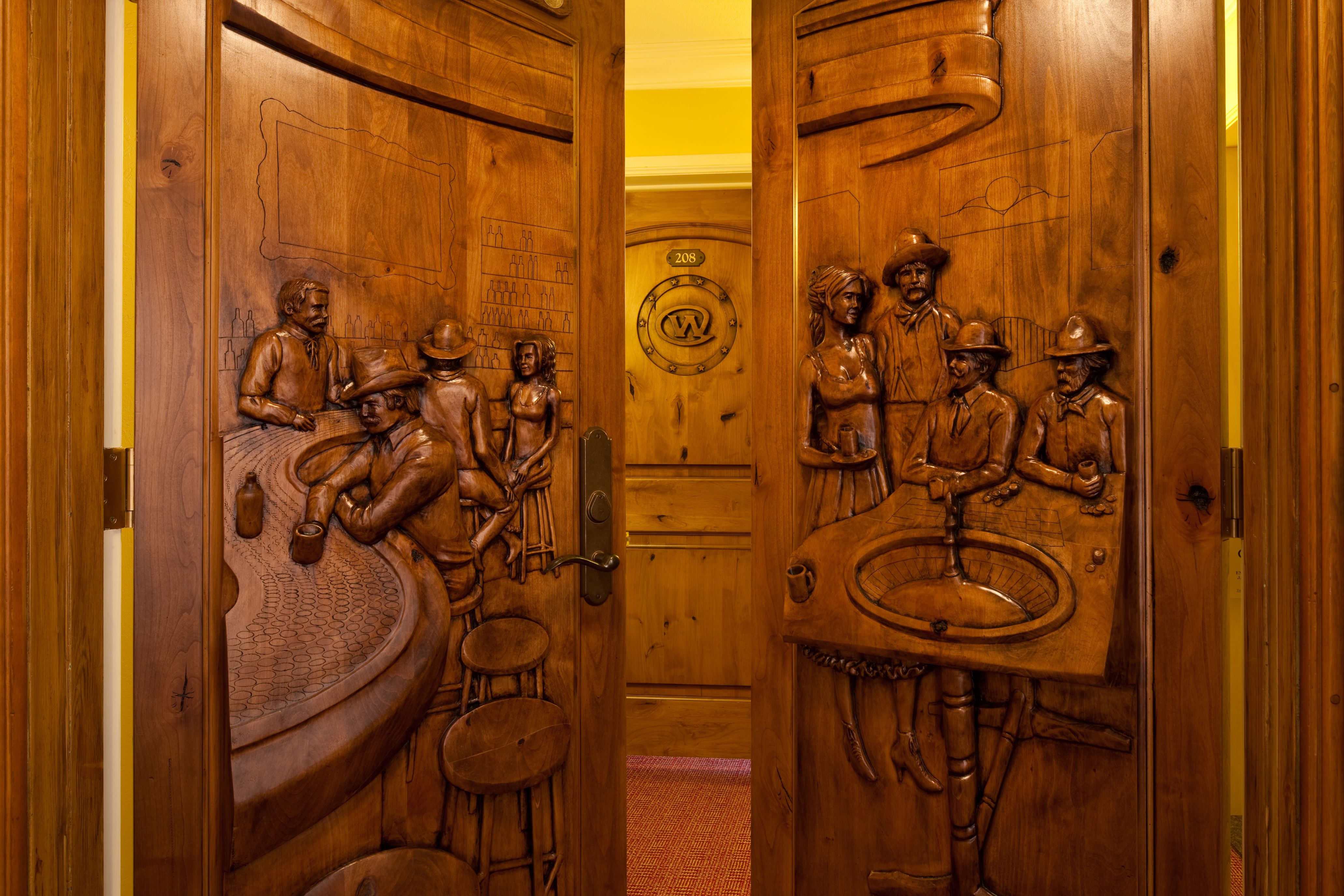 Image of carved wooden doors in the Silver Dollar Suite at The Wort Hotel, a member of Historic Hotels of America since 2002, located in Jackson Hole, Wyoming
